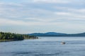 SIDNEY, CANADA - JULY 14, 2019: boat in haro strait view from Vancouver island with cloudy sky British Columbia Canada