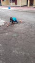 Sidoarjo, A boy playing colorful marbles