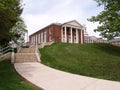 Sidwalk and steps leading to an old school