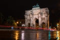 The Siegestor Victory Arch in Munich. Triumphal arch at night on a rainy day. Side view.