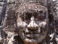 Close-up of a woman`s face carved in stone at Bayon Temple in the Khmer temple complex of Angkor