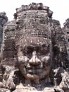 Face of a woman carved in stone at Bayon Temple in the Khmer temple complex of Angkor