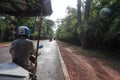 Siem Reap, Cambodia - August 3th, 2016: The tuk-tuk car driver, fast, not expensive, and convenient. Royalty Free Stock Photo