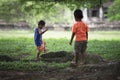 Siem Reap, Cambodia - 08 08 2014: Cambodian kids playing in the jungle at Angkor Wat, Siem Reap, Cambodia