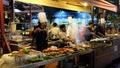 Asian street chefs cooking exquisite oriental delicacies at night. Asian street food,