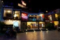 The facade of a small Cambodian cafe on a winter evening, an Asian restaurant