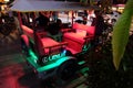 Motor rickshaw with neon Lexus, Asian taxi