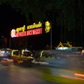 Night market, traffic on the road, motion blur