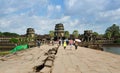 Siem Reap, Cambodia - December 2, 2015: People visit ruined towers on the west of the outer enclosure at Angkor Wat