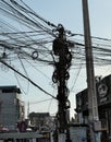 Power line pole with a huge number of wires. A dense network of electrical wires