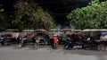 Rickshaws parked on a city street, Asian taxi