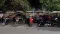 Rickshaws parked on a city street, Asian taxi