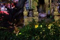 Small Hindu sanctuary on the street of an Asian city, night time