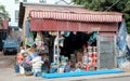 Small shop of industrial goods. A small blue car near the store