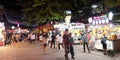 Throngs of people meandering down the vibrant Pub Street in Cambodia, a popular hub for