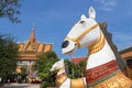 Siem Reap, Cambodia - February 2, 2017: Statues of horses in courtyard of buddhist temple Preah Prom Rath