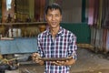 Siem Reap, Cambodia - January 03, 2017: An artisan at the palm sugar producers village showing one of his wooden work