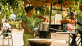 Woman cooks on the side on the street