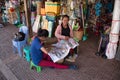 Local women preparing traditional cambodian, khmer handiwork on a street market in Siem Reap