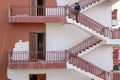 Siem Reap, Cambodia - 25 March 2018: big house ceiling with outside stairs and woman. Multi-floor building