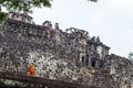 Siem Reap, Cambodia - 25 March 2018: Buddhist monks in orange clothes in Angkor Wat temples.