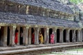 Siem Reap, Cambodia - 27 March 2018: Chinese tourist in Angkor Wat complex. Young women in dresses making photos