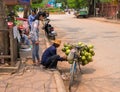 Siem Reap, Cambodia - 30 March, 2018: Coconut seller on bicycle. Simple job selling coco nuts.