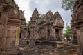 Siem Reap, Cambodia - 29 March 2018: tourists in angkorian temple Banteay Srei. Stone carved decor on hindu temple