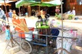 Female is squeezing sugar cane juice Royalty Free Stock Photo