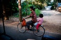 Siem Reap, Cambodia - September 12, 2010: Cambodian citizens traveling by bicycle on a road