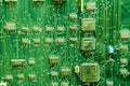 Siemens circuit pack, green computer board background. Telephone electronic circuit with transistors