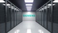 Siemens logo on the wall of the server room. Editorial 3D rendering Royalty Free Stock Photo