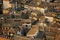 Siena cityscape. Picturesque aerial view of typical buildings red roofs from above at sunset from Torre del Mangia tower, Tuscany