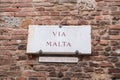 Traditional marble street sign in the historical city of Siena, Tuscany, Italy, Via Malta