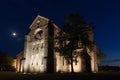 The San Galgano roofless abbey illuminated at sunset in summer