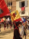 Tourists watching the colorful and fancy traditional costume parades at the horse race, Palio di Siena, held in medieval square