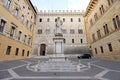 SIENA, ITALY - JUNE 22, 2022: Palazzo Salimbeni palace, the Main Office or Headquarter of Monte dei Paschi Bank, with Statue of Royalty Free Stock Photo