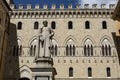 SIENA, ITALY - MAY 11, 2023: Palazzo Salimbeni palace, the Main Office or Headquarter of Monte dei Paschi Bank, with Statue of Royalty Free Stock Photo