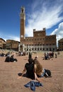 SIENA, ITALY - MAY 11, 2023: People visit Piazza del Campo in Siena, Italy. Siena as a UNESCO World Heritage Site is an important