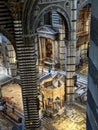 SIENA, ITALY - SEPTEMBER 23, 2023 - Rich ornate marble pulpit in the Siena cathedral, designed by Niccolo Pisano