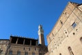 Siena, SI, Italy - February 20, 2023: High Tower called Torre del Mangia and ancient palaces