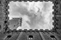 Siena Tower - Looking up towards Torre del Mangia Mangia tower from inside of Palazzo Publico inner courtyard in Siena, Tuscany