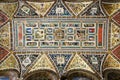 Piccolomini Library room ceiling frescoes details of vibrant colors and statues