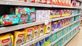 Supermarket shelves with baby products: diapers