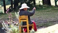 A Native Mexican Woman knits at the main entrance to the Sierra Chincua Monarch Butterfly Sanctuary