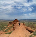 Sierra de Armantes, a small desert in Aragon a person walking towards the castle