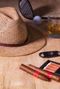 Siesta - cigar, straw hat,Scotch whiskey and golf driver on a wooden desk Royalty Free Stock Photo