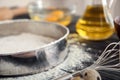 Sieve, flour and whisk on kitchen table. Bakery workshop Royalty Free Stock Photo