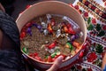 sieve with sweets and wheat. wedding ceremony of sprinkling the bride and groom. editorial photo. wedding traditions in