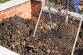 Sieving the composted earth Royalty Free Stock Photo